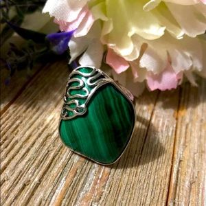 Beautiful stainless steel ring with a green gem